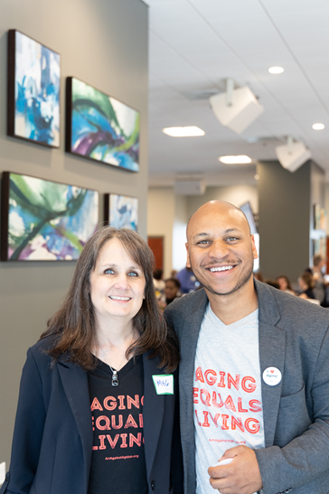 Two people pose for a photo at the 2026 Aging Summit.