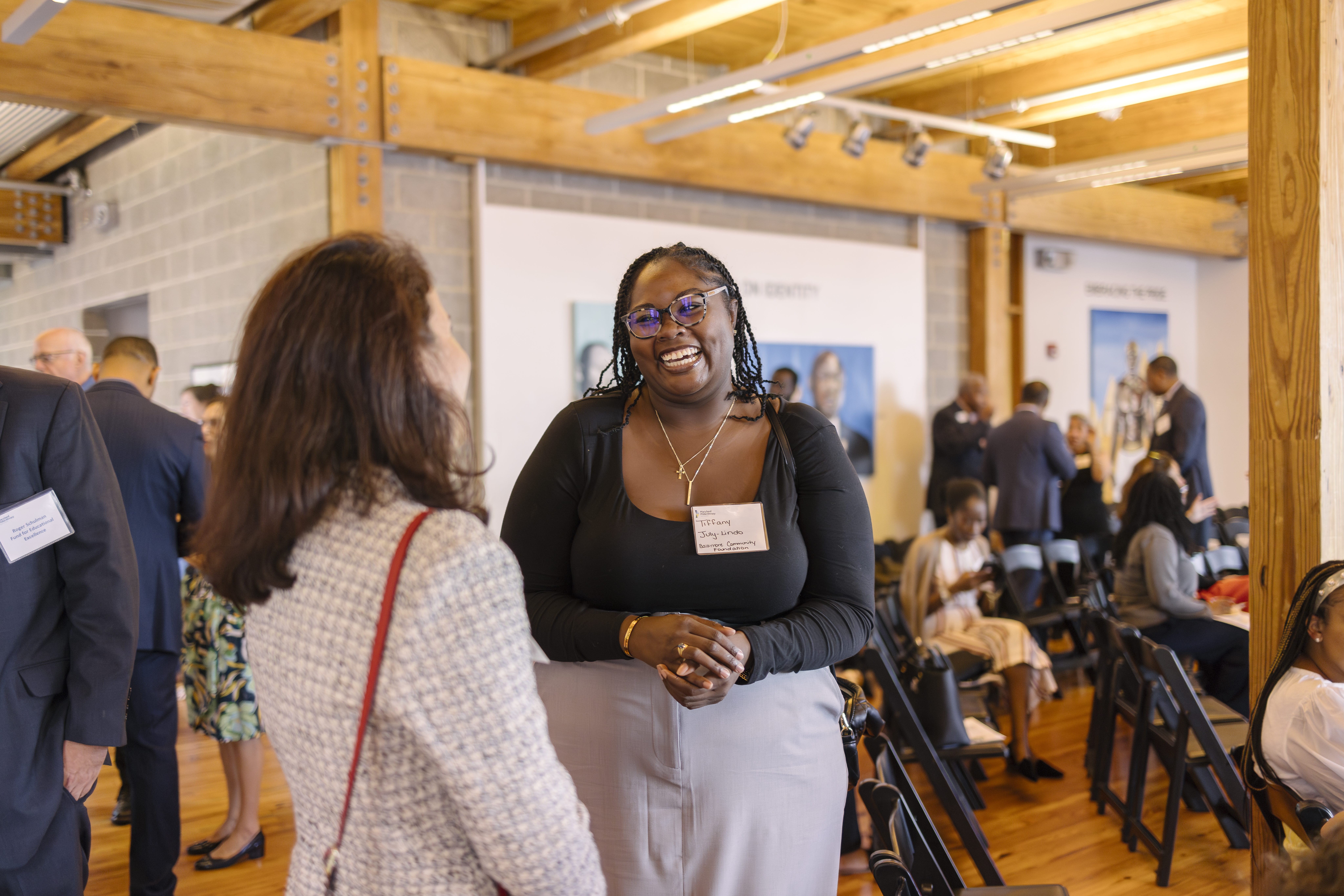 Two MPN members chatting and smiling to one another at the 2024 Annual Member Gathering.