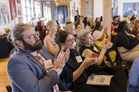 The seated audience claps during the 2024 Annual Gathering.