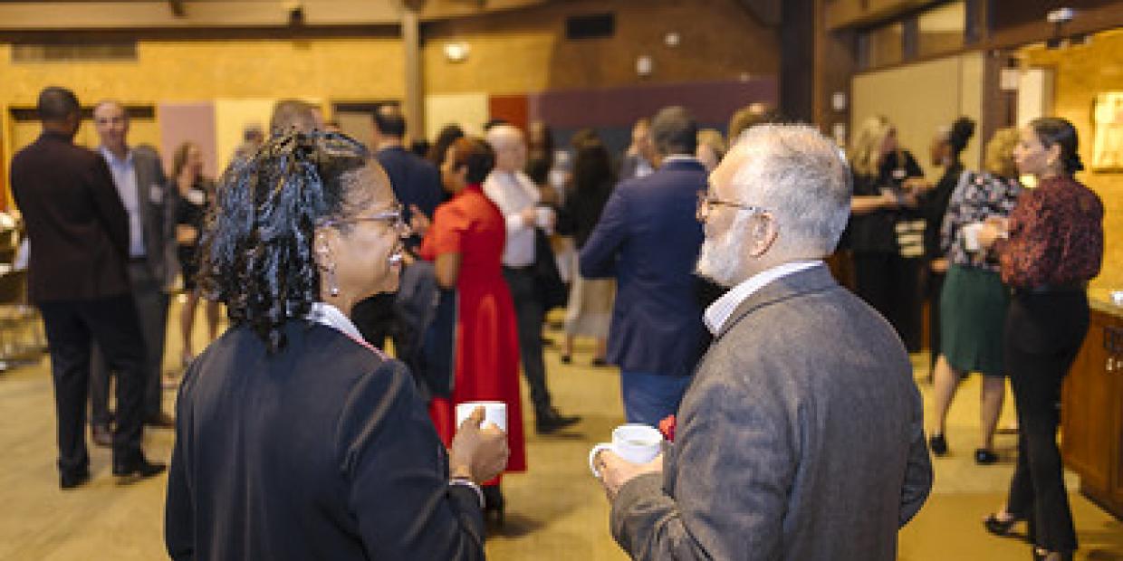 MPN members share coffee before a keynote address at the 2025 Annual Gathering.