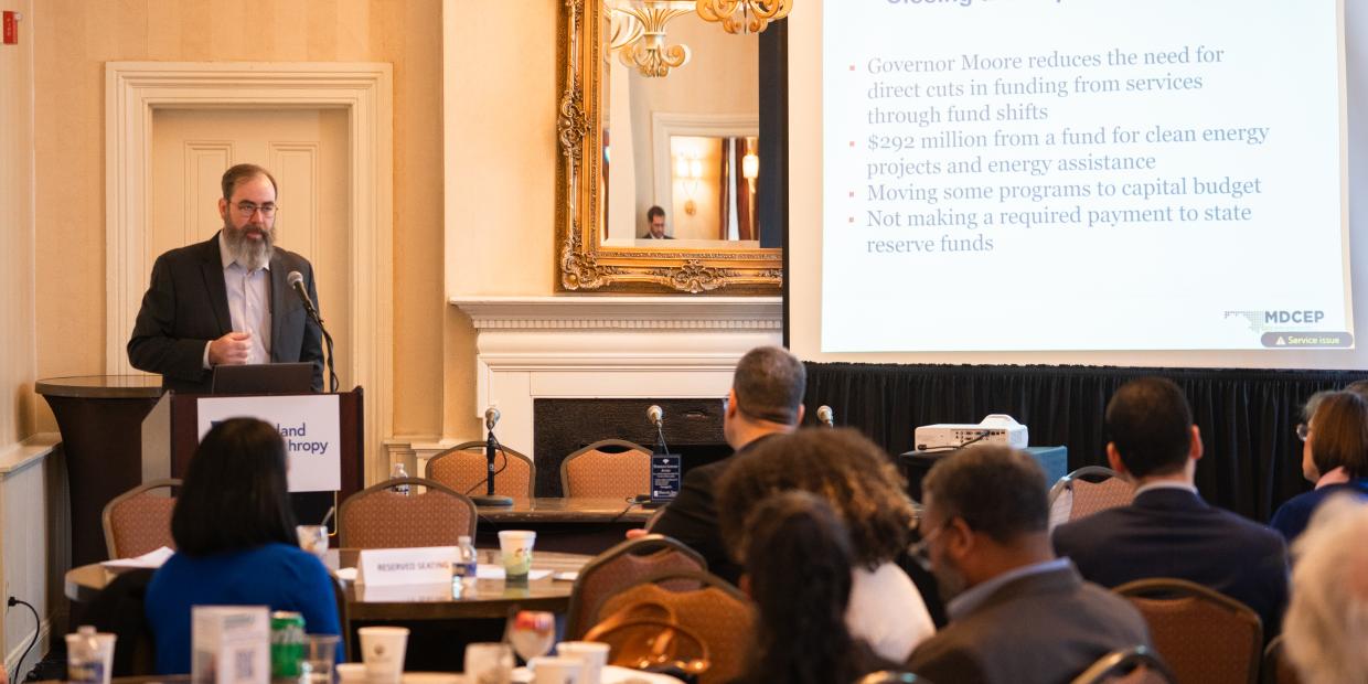 Benjamin Orr presents at the podium during the 2026 Philanthropy Summit in Annapolis.