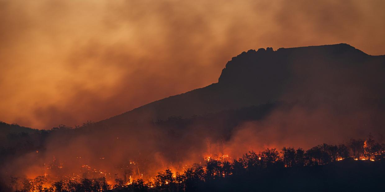 Wildfire and smoke on a mountain.